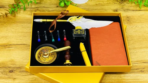 Lələk dəsti qızılı qutuda — alov qələmli